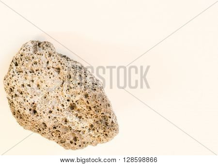 Lower left close up small stone with many holes