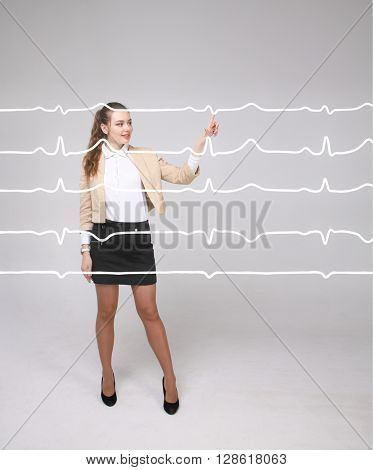 Doctor woman working with cardiogram lines