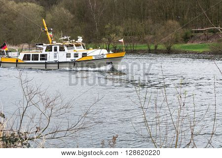 ESSEN NRW GERMANY - APRIL 4 2016: River supervisor boat Bussard MS at a check ride on the river Ruhr in Germany. Boat in use for water protection.