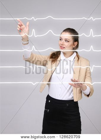 Doctor woman working with cardiogram lines