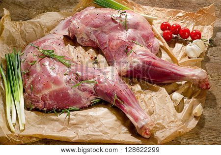 Raw Lamb Shanks Ready For Frying On A Wooden Board.