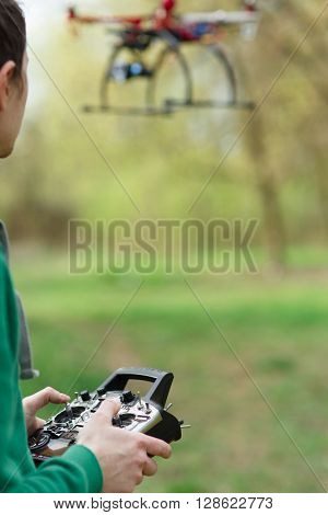 Man controling a drone.