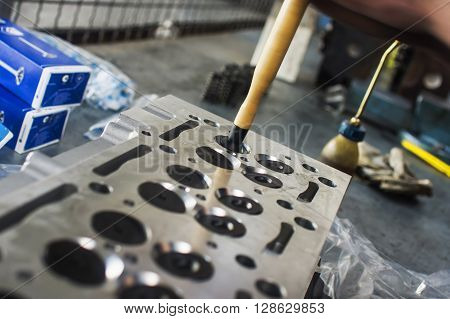Hands Repairing A Car Engine With A Wrench