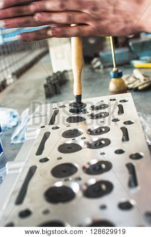 Hands Repairing A Car Engine With A Wrench