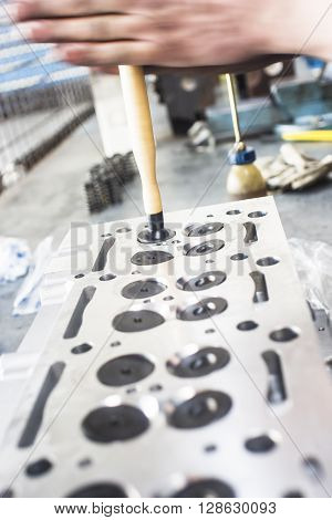 Hands Repairing A Car Engine With A Wrench