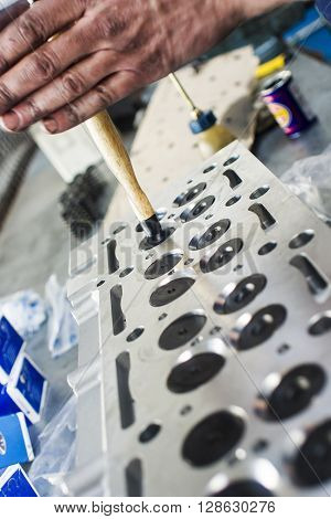 Hands Repairing A Car Engine With A Wrench