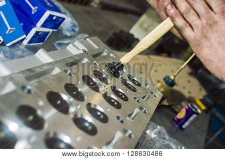 Hands Repairing A Car Engine With A Wrench