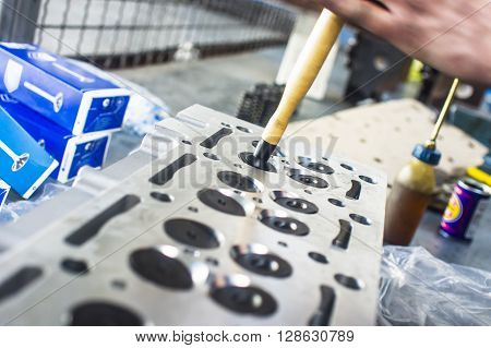 Hands Repairing A Car Engine With A Wrench