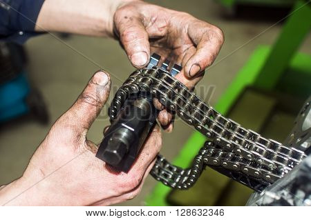 Hands Repairing A Car Engine With A Wrench
