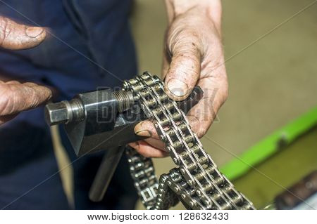 Hands Repairing A Car Engine With A Wrench
