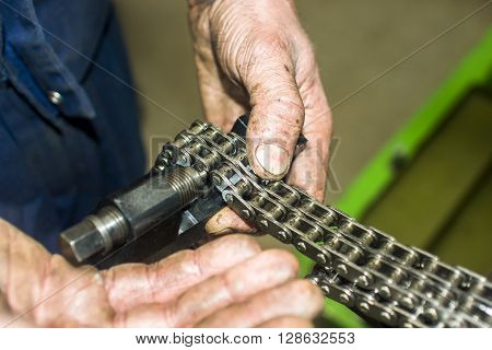 Hands Repairing A Car Engine With A Wrench