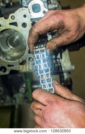 Hands Repairing A Car Engine With A Wrench