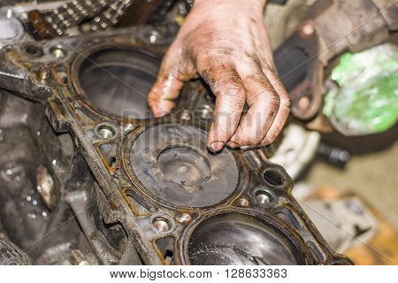 Hands Repairing A Car Engine With A Wrench