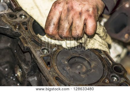 Hands Repairing A Car Engine With A Wrench