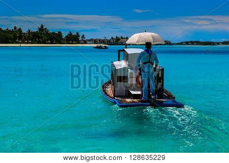 Maldives island - sandy beach and indian ocean, boat
