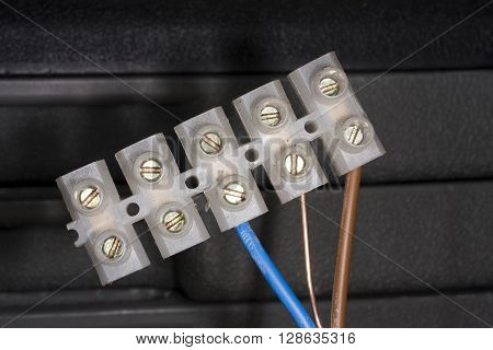 Plastic wire connection block with three core UK specification 13 amp cable.