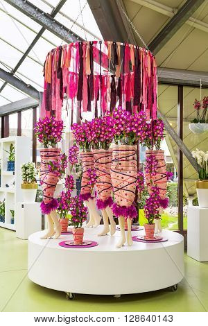 Lisse, Netherlands - April 4, 2016: Flower greenhouse orchid pavillion, floristic decor elements in dutch park spring garden Keukenhof, Lisse, Holland