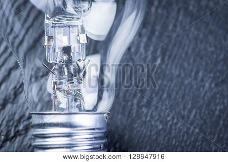 Tungsten Bulb On A Black Table