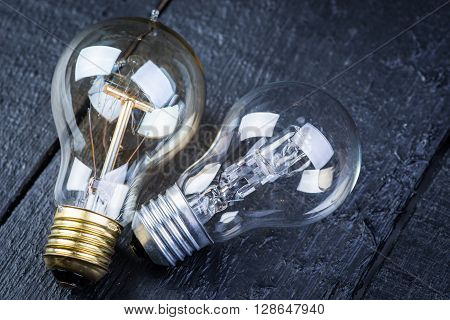 Tungsten bulb on a black wooden table