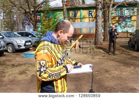 Saint-Petersburg, Russia - April 24, 2016: Paintball tournament in Snaker club between student teams from five universities. Referee.