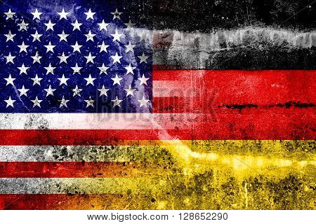 USA and Germany Flag painted on grunge wall. Vintage and old look.