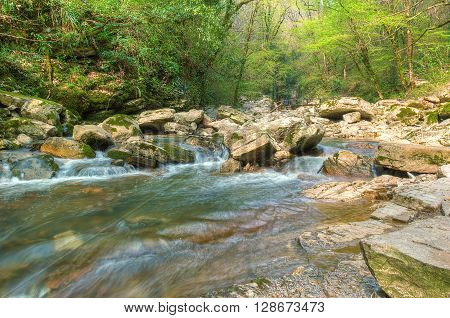 Cascade on mountain river Agura in Sochi Krasnodar Krai Russia HDR processing