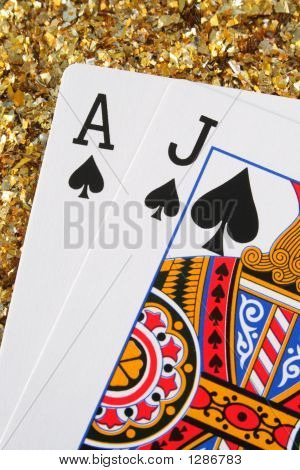 Blackjack/ponton kort med en guld Glitter baggrund.