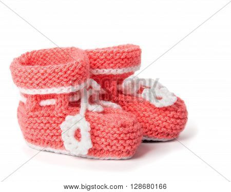 Cute wolen baby shoes on white background