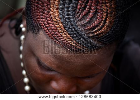 Sierra Leone, West Africa - June 2, 2013: the beaches of the Bunce Island, situated in Freetown Harbour, typical hairstyle African woman