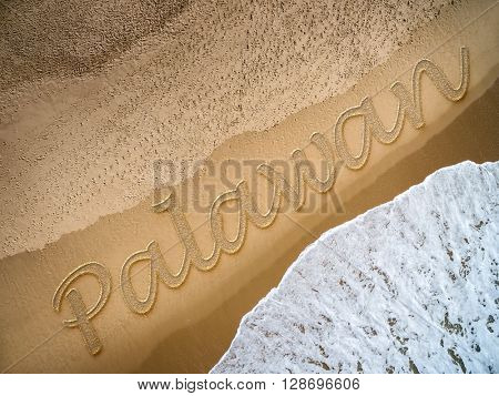 Palawan written on the beach