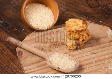 Traditional Brazilian Rice Bolinho over wooden table