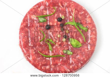 Raw beef hambuger isolated on white background top view