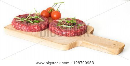 Raw beef hambuger isolated on white background