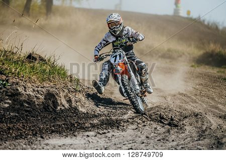 Miasskoe Russia - May 02 2016: racer on a motorcycle turns on a dusty race track during Cup of Urals motocross