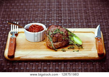 Beautiful Juicy Well Done Steak With Sauce On A Wooden Board