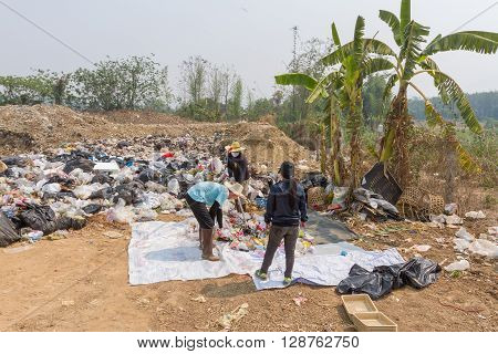 PAI, THAILAND - April 10, 2016 : Councils officer prepare Screeners in the garbage disposal pond in Pai,Thailand