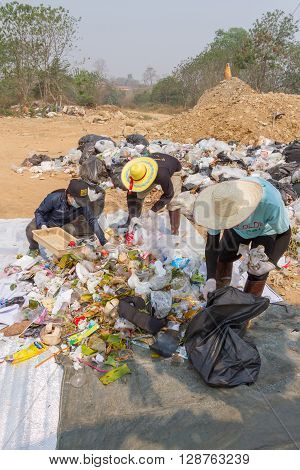 PAI, THAILAND - April 10, 2016 : Councils officer prepare Screeners in the garbage disposal pond in Pai,Thailand
