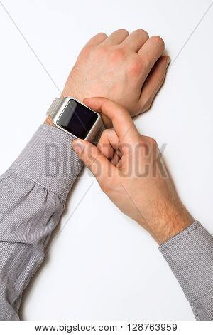 smart watch on a male hand on white background. Mock up. Top view