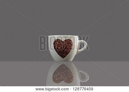 a coffee cup a love shape and a reflection