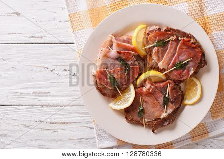Beef Saltimbocca With Sage And Ham Close-up. Horizontal Top View