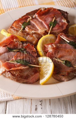 Italian Beef Saltimbocca With Sage, Ham And Lemon Close-up. Vertical