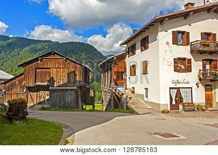 Colle Santa Lucia, Italy - September 6, 2012: Old houses in the small town of Colle Santa Lucia along the Great Dolomite Road in Italian Alps