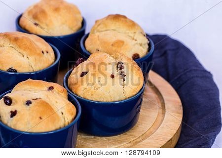 Tasty muffins with blueberry on white background