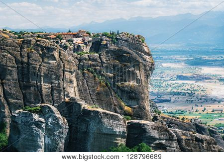 View of The Holy Monastery of St. Stephen at the complex of Meteora monasteries in Greece. Steep cliffs and mountains in the valley of Thessaly