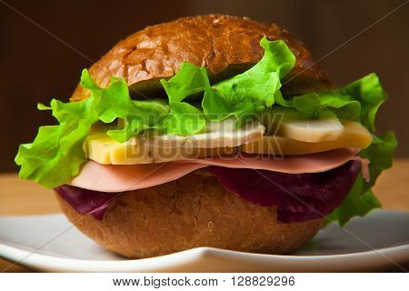 Sandwich with chicken, cheese and salad. Healthy fast food.
