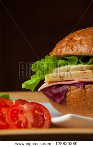 Sandwich with chicken, cheese and salad. Healthy fast food.
