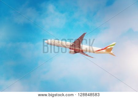 DUBAI, United Arab Emirates - DECEMBER 22, 2016: An Emirates aircraft Boeing 777-31HER is taking off from DXB airport