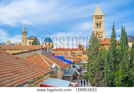 The old city consists of the old stone buildings with the tiled roofs numerous churches mosques and synagogues Jerusalem Israel.
