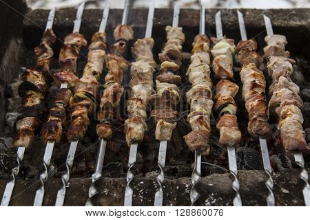 Barbecue skewers with meat on the brazier