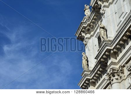 Church in Venice with sky. Detail from the baroque facade of San Salvador (Holy Savior) designed by Giuseppe Sardi in 1663
